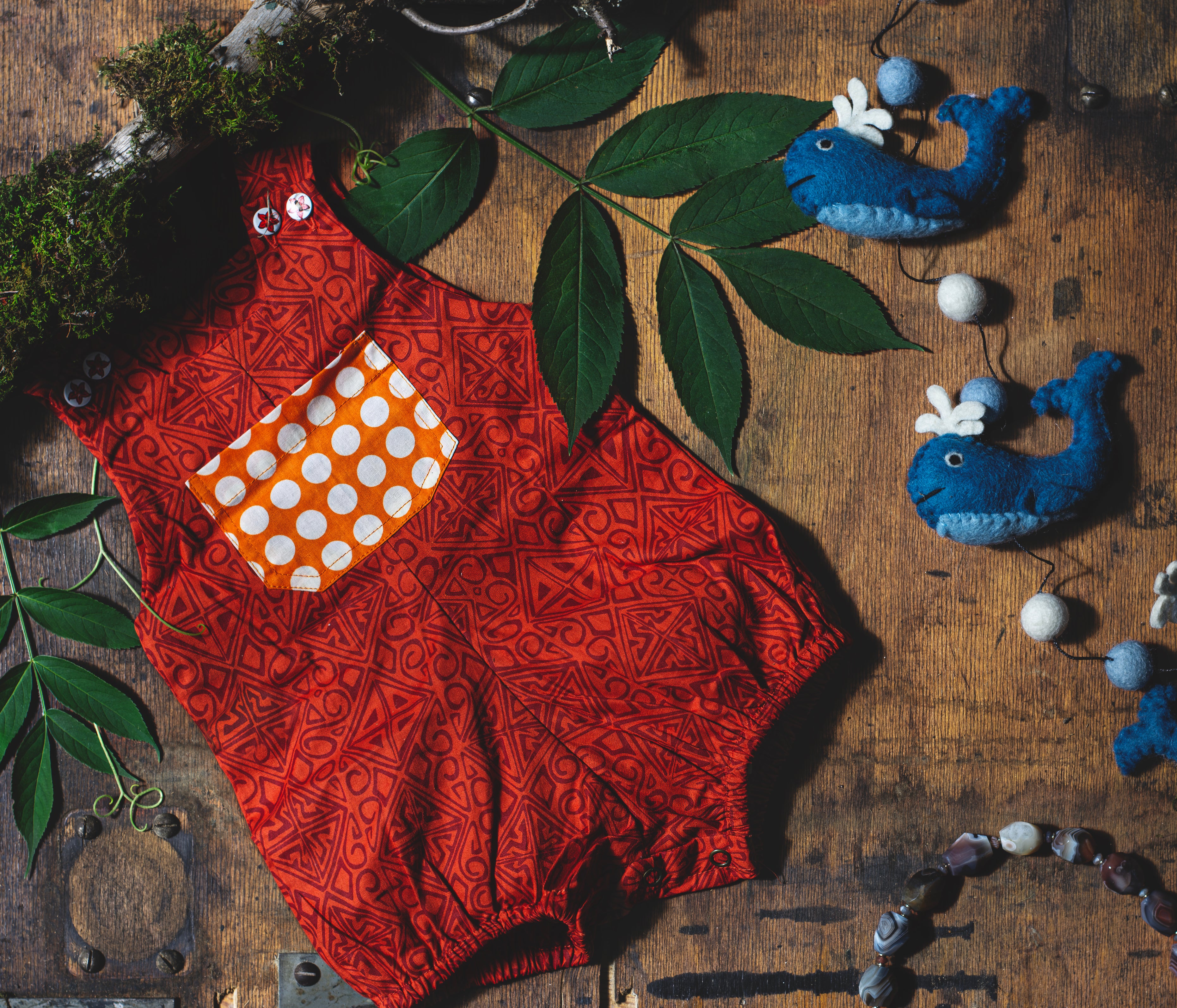 image displays a collage of children's items in a woodsy setting